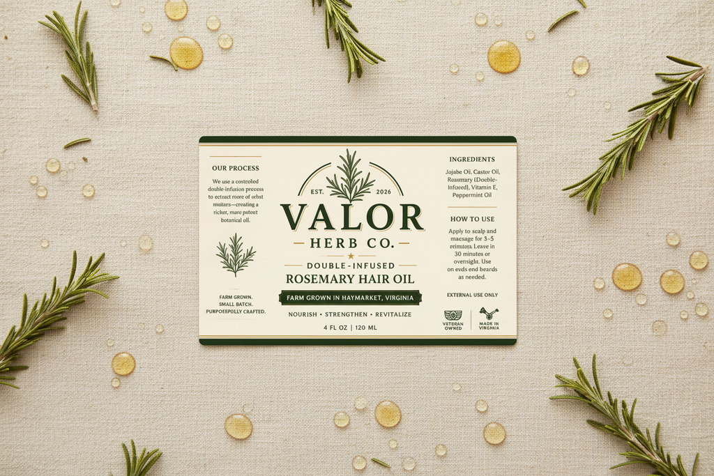 Valor Herb Co. rosemary hair oil packaging on a textured beige background with rosemary leaves.